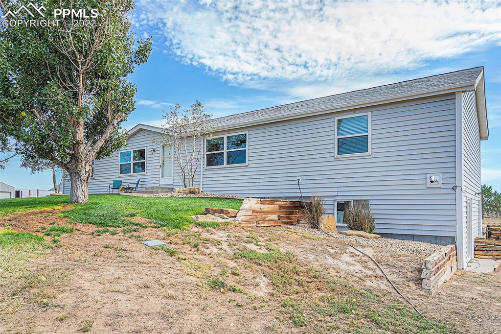 3180 Calhoun Byers Road Byers, CO 80103 - Photo 44 of 48 a view of a house with a yard