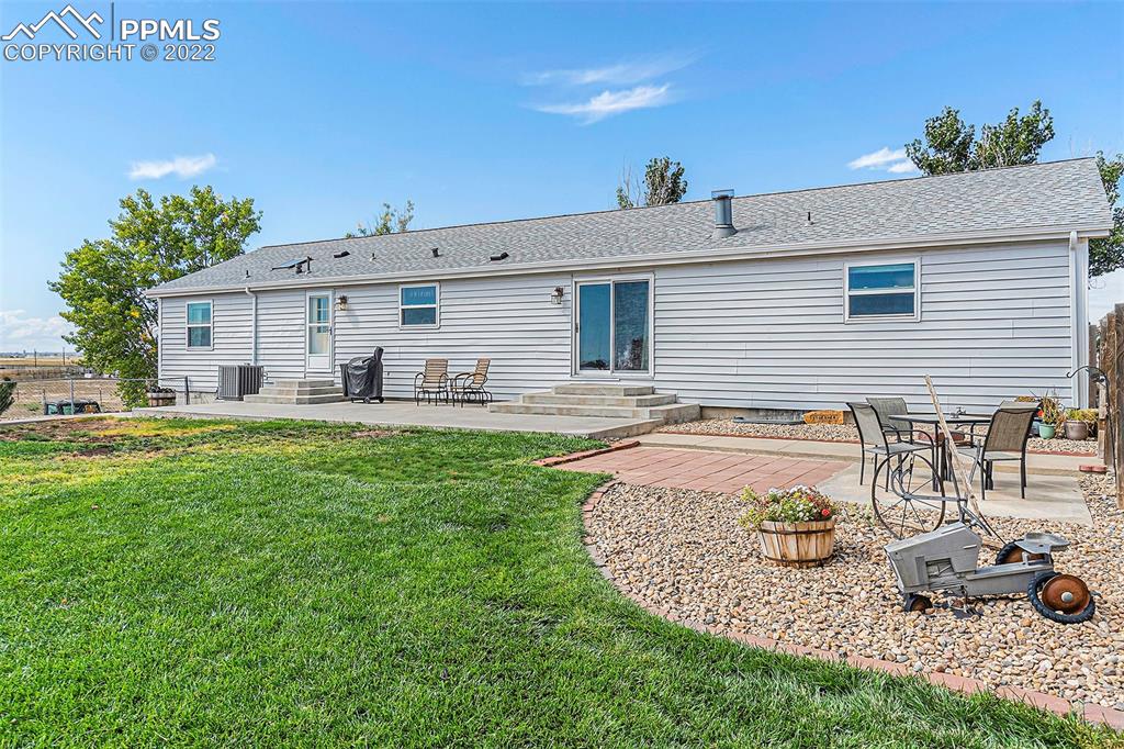 3180 Calhoun Byers Road Byers, CO 80103 - Photo 47 of 48 a front view of a house with garden
