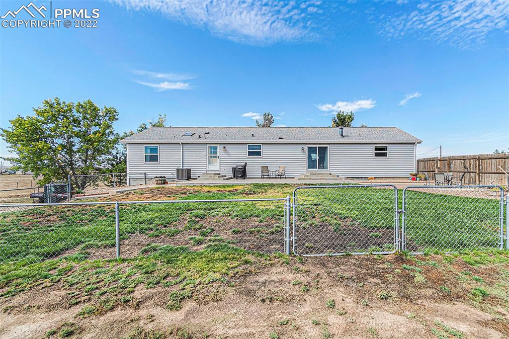 3180 Calhoun Byers Road Byers, CO 80103 - Photo 48 of 48 a front view of a house with a yard