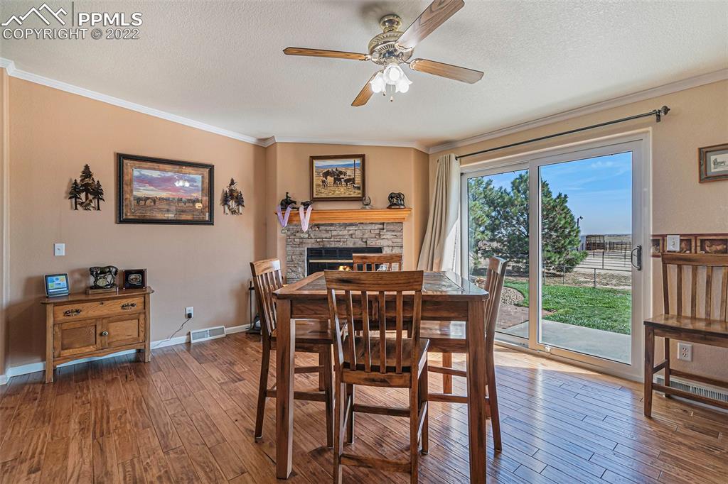 3180 Calhoun Byers Road Byers, CO 80103 - Photo 10 of 48 a view of a dining room with furniture window and wooden floor