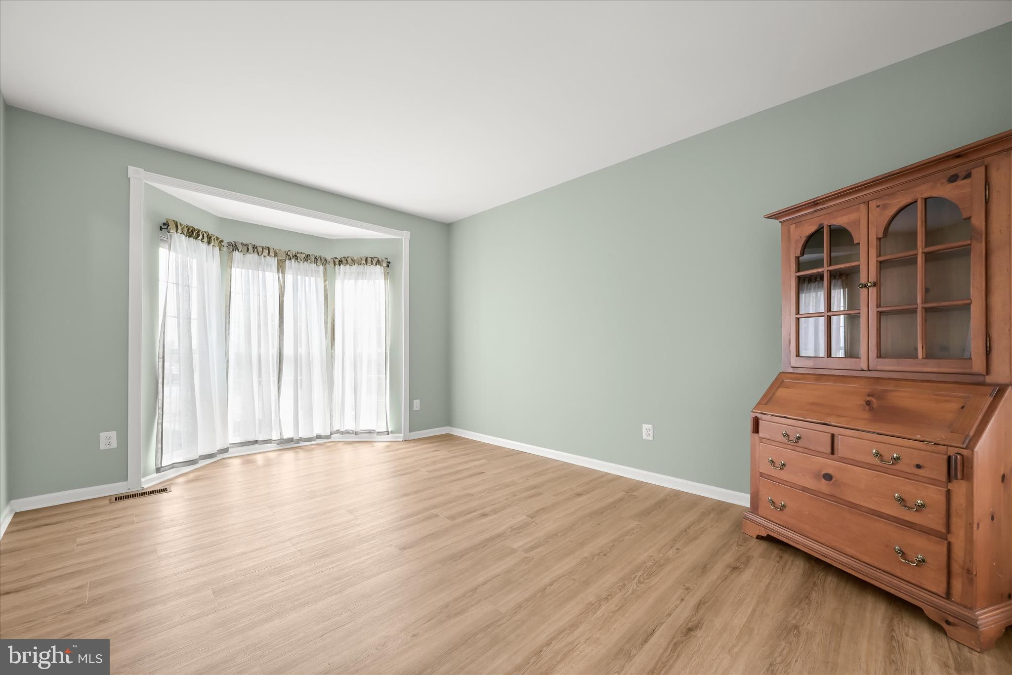 2028 Meadow Tree Court Cooksville, MD 21723 - Photo 13 of 73 wooden floor in an empty room with a window