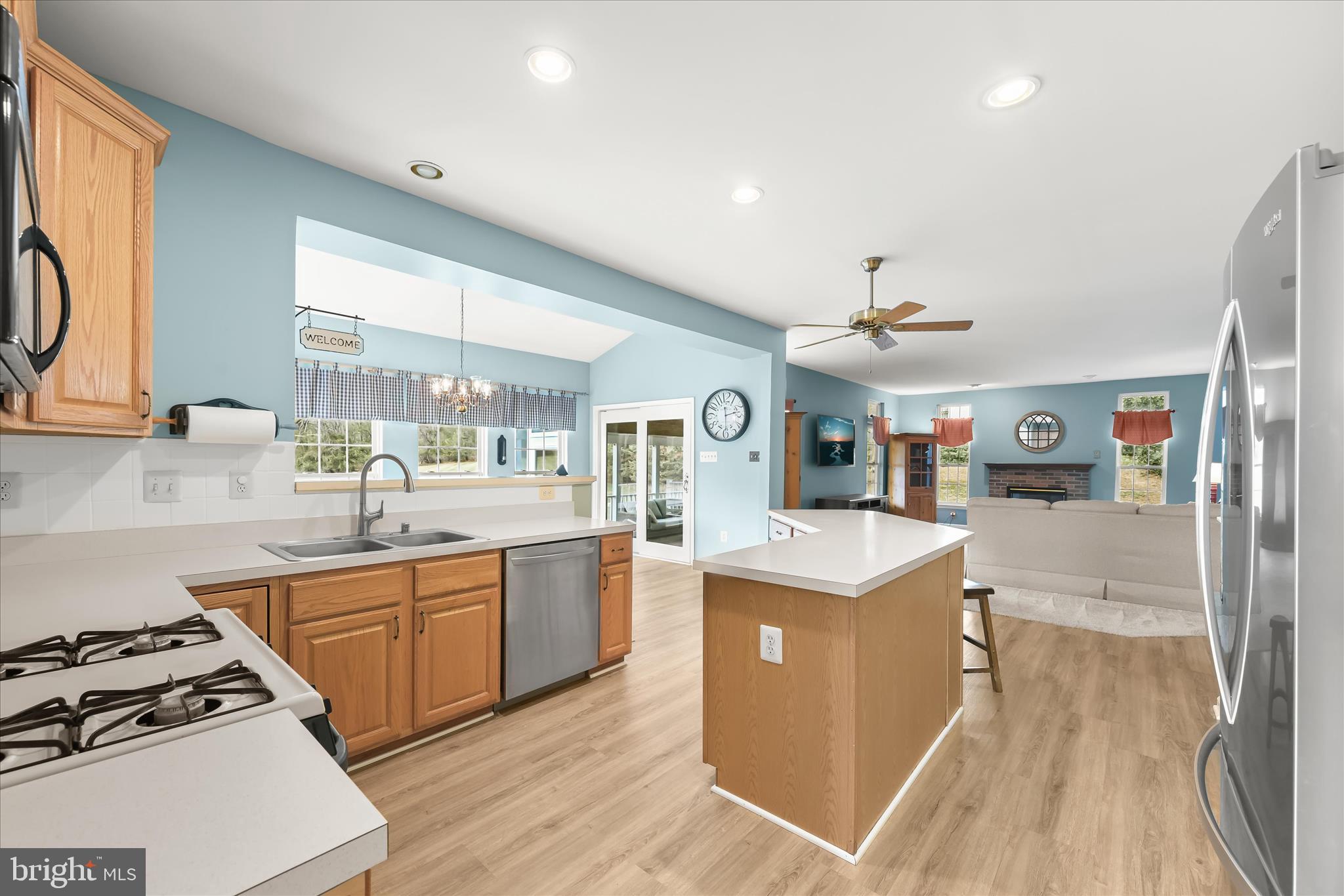2028 Meadow Tree Court Cooksville, MD 21723 - Photo 17 of 73 a kitchen with stainless steel appliances granite countertop a stove and a sink