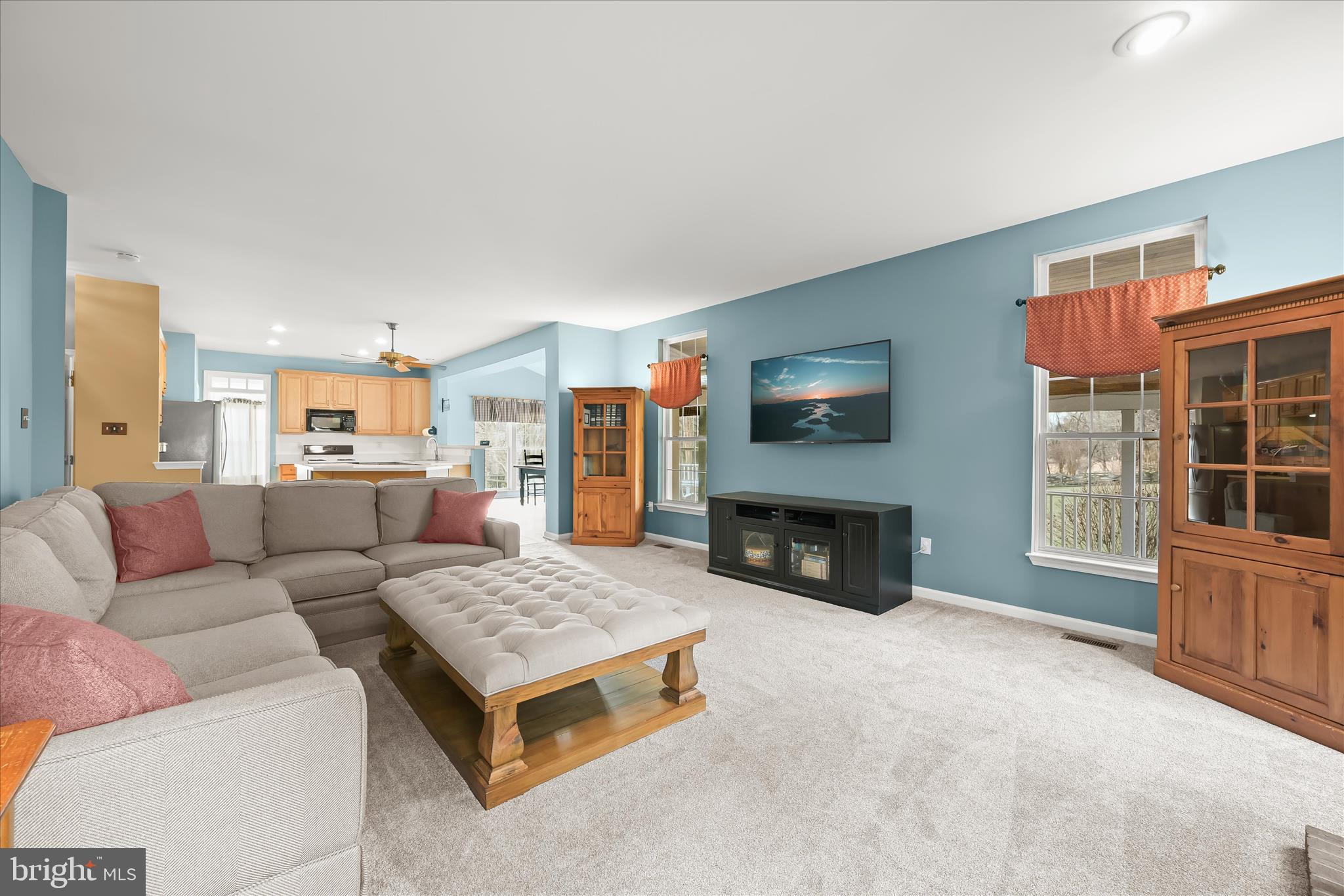 2028 Meadow Tree Court Cooksville, MD 21723 - Photo 27 of 73 a living room with furniture and a fireplace