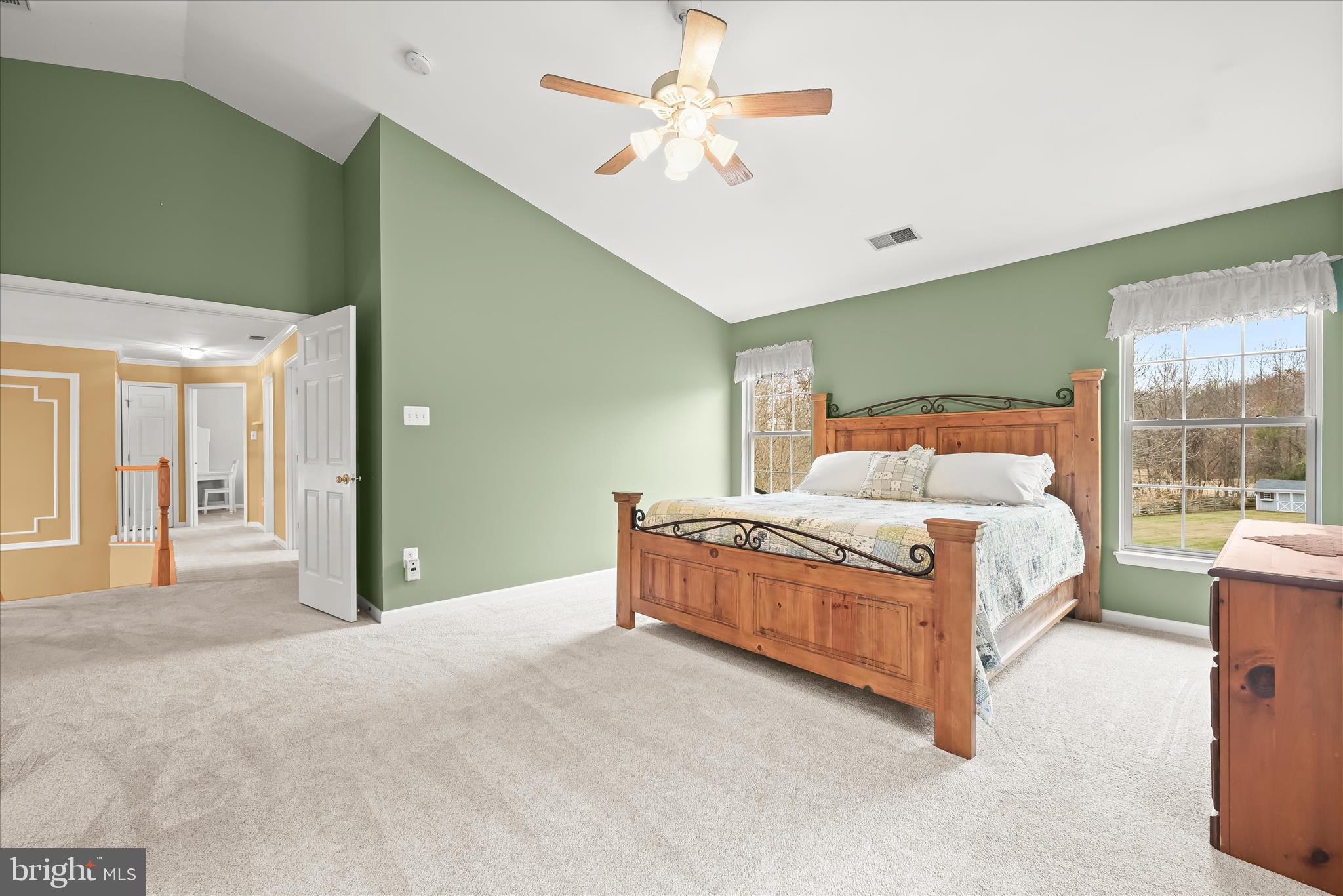 2028 Meadow Tree Court Cooksville, MD 21723 - Photo 31 of 73 a bedroom with a large bed and a chandelier
