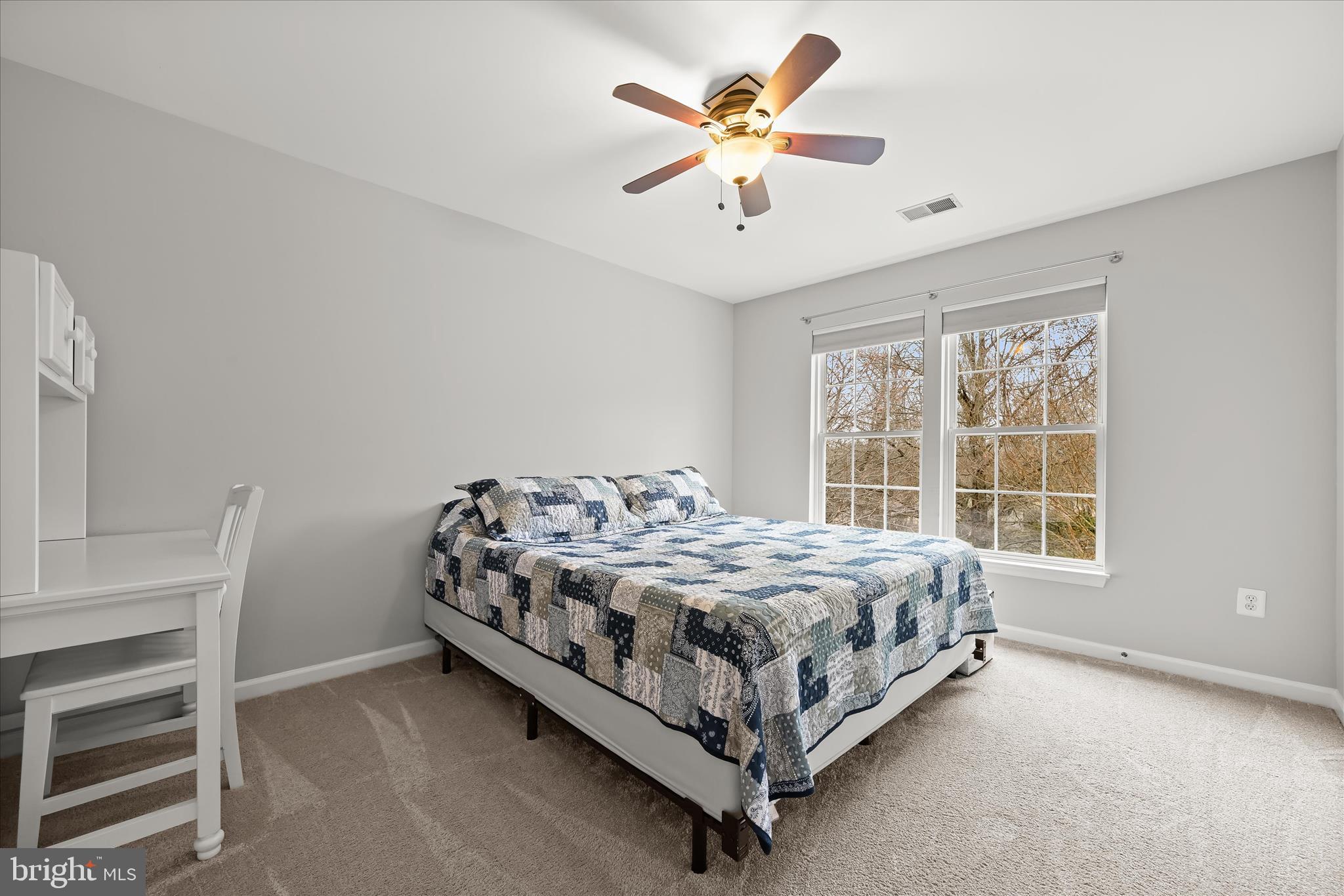 2028 Meadow Tree Court Cooksville, MD 21723 - Photo 43 of 73 a bed sitting in a bedroom next to a window