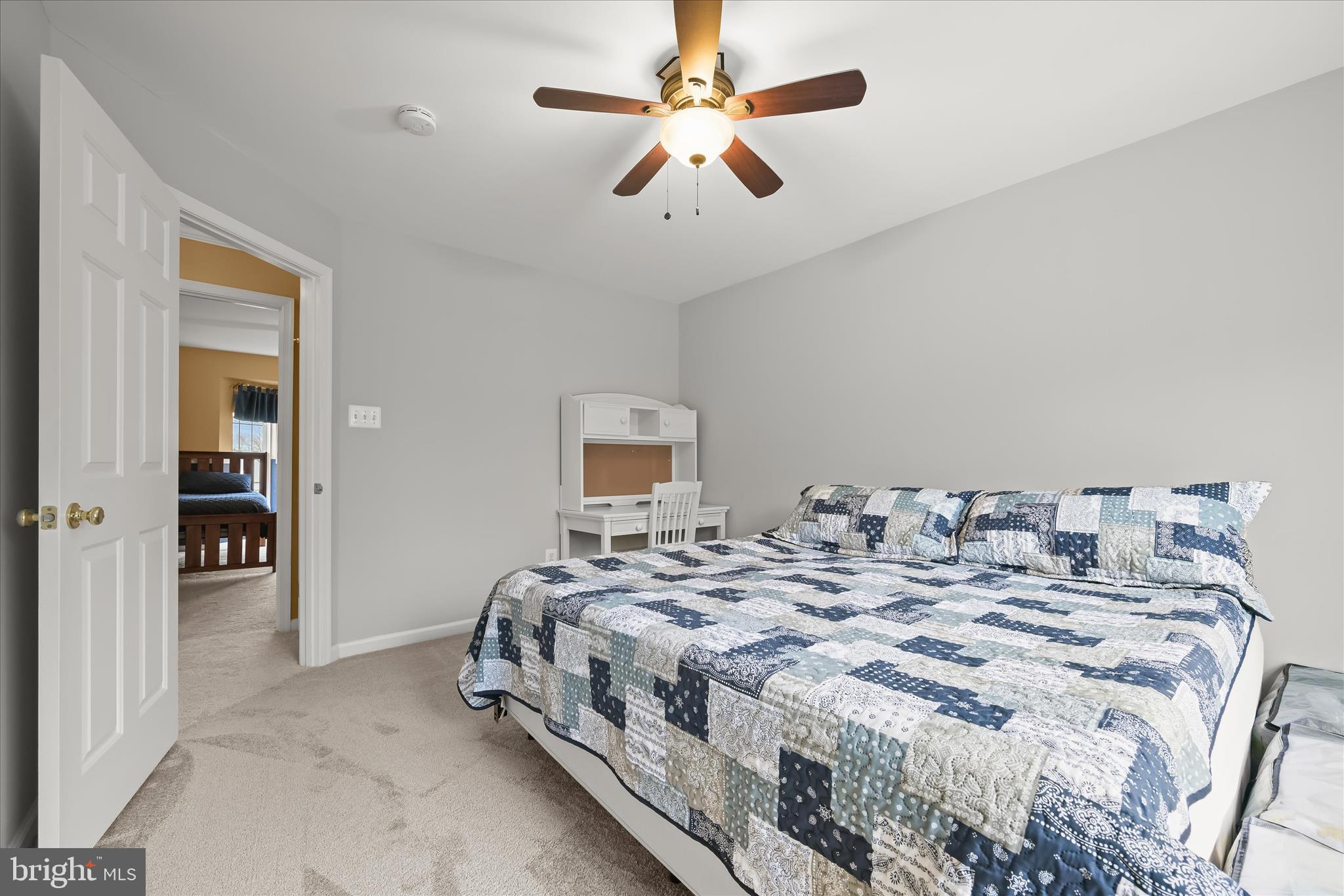 2028 Meadow Tree Court Cooksville, MD 21723 - Photo 44 of 73 a bedroom with a bed and a ceiling fan