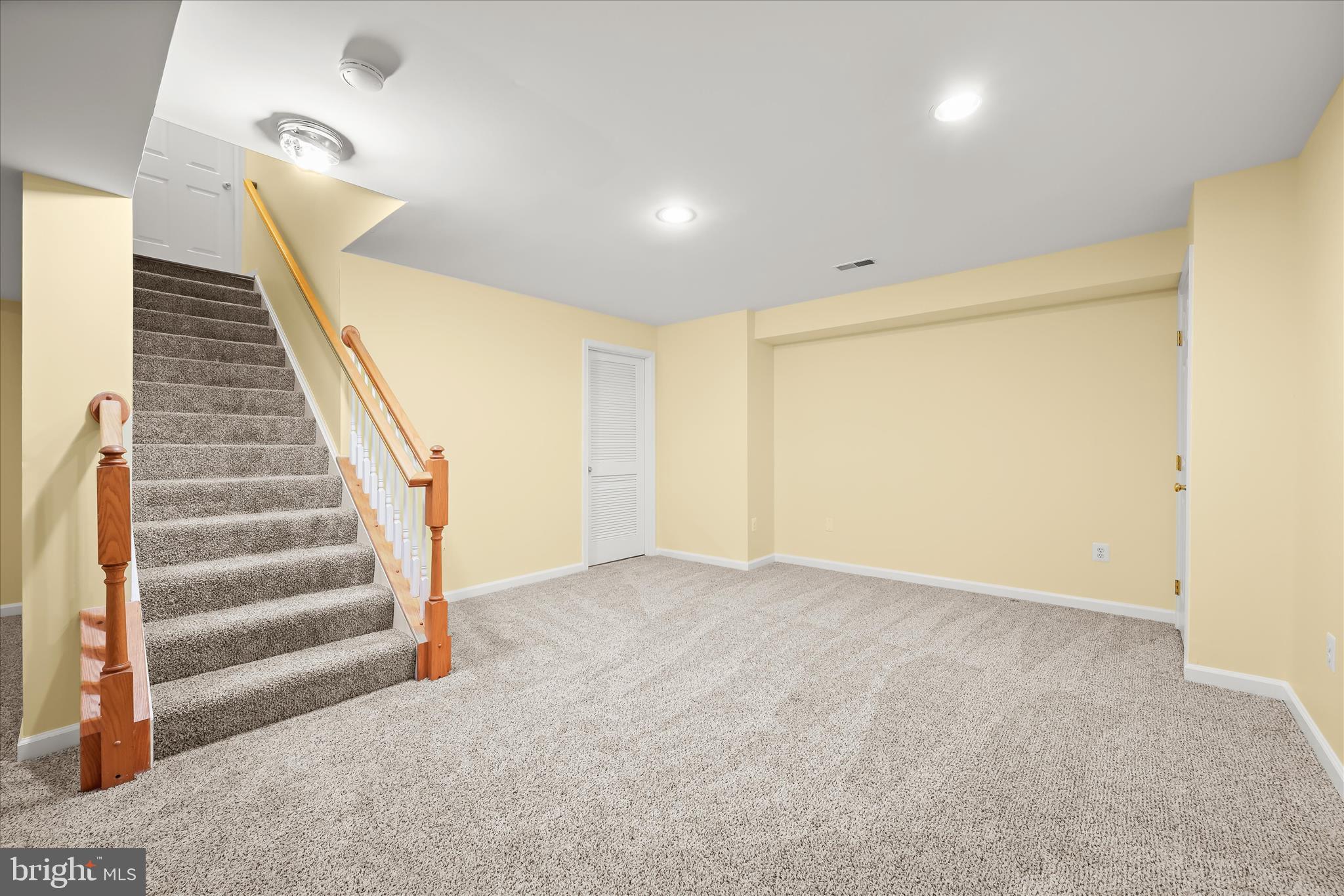 2028 Meadow Tree Court Cooksville, MD 21723 - Photo 45 of 73 a view of an empty room with stairs