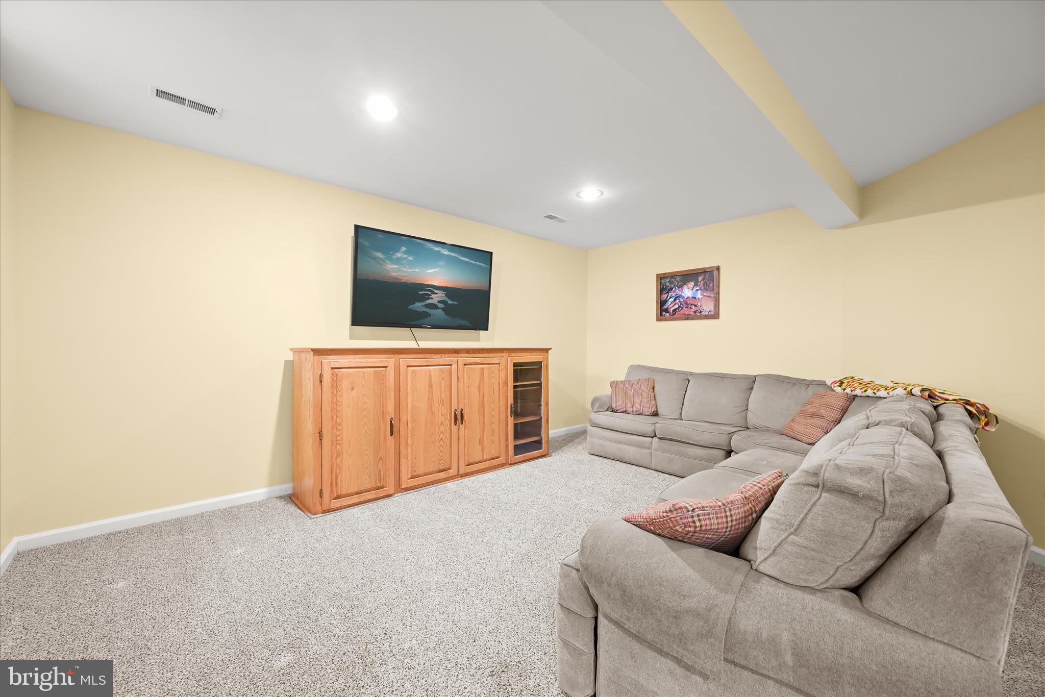 2028 Meadow Tree Court Cooksville, MD 21723 - Photo 48 of 73 a living room with furniture and a flat screen tv