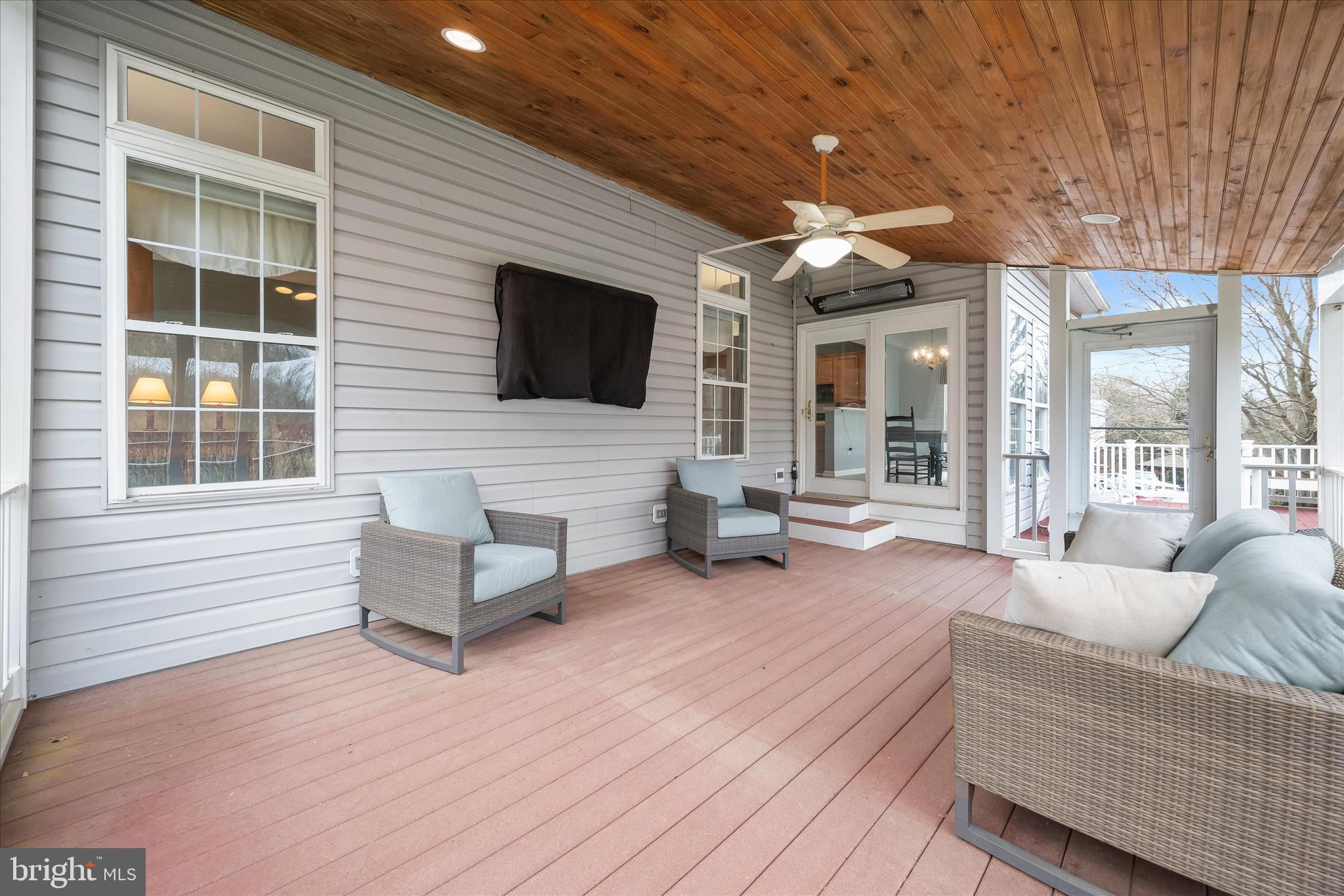 2028 Meadow Tree Court Cooksville, MD 21723 - Photo 51 of 73 a living room with furniture a flat screen tv and a fireplace