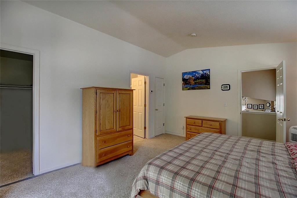 686 Alpine Road Dillon, CO 80435 - Photo 14 of 35 a bedroom with a bed and a television