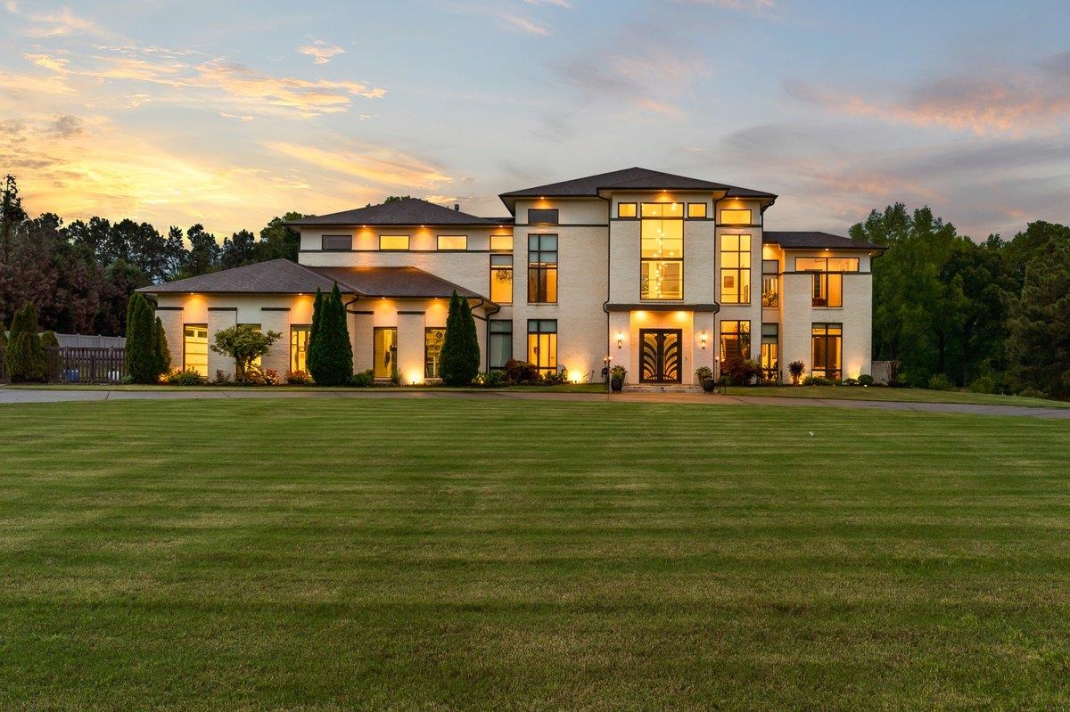 a front view of building with yard