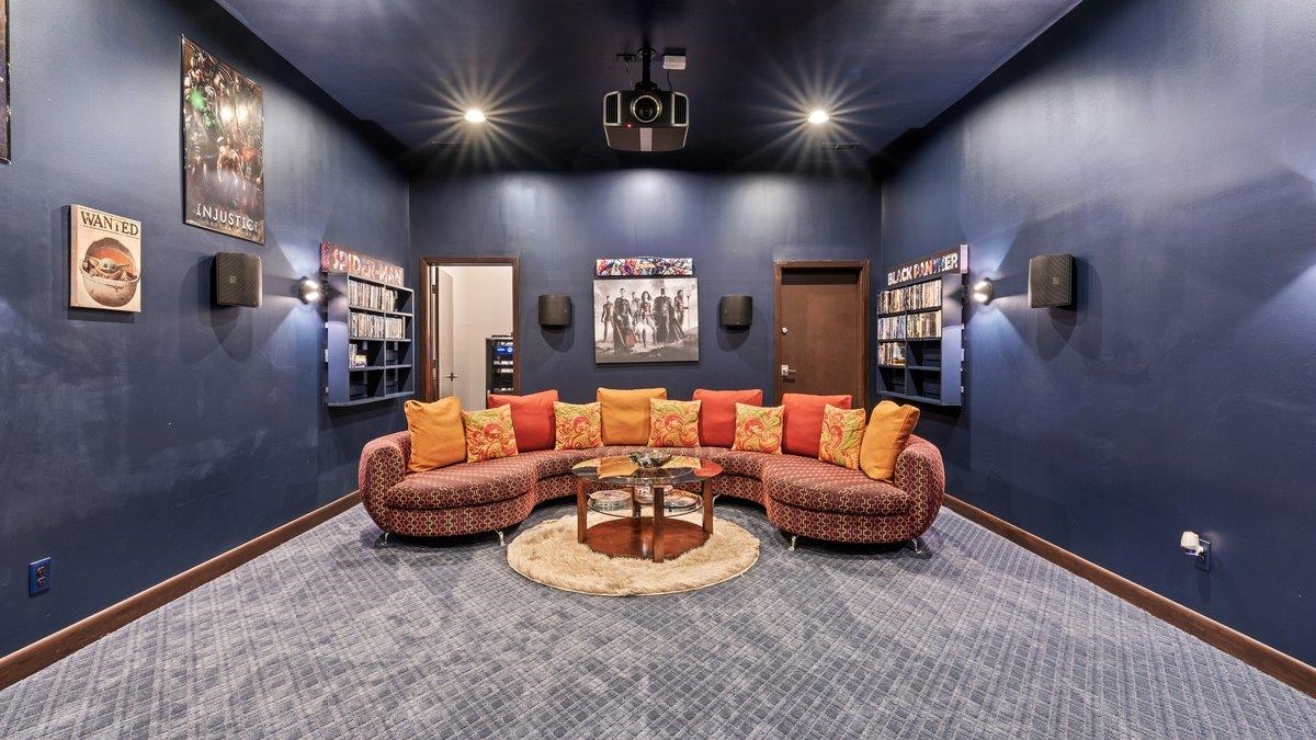 9942 Legends Drive Collierville, TN 38139 - Photo 23 of 40 a living room with furniture and a projector