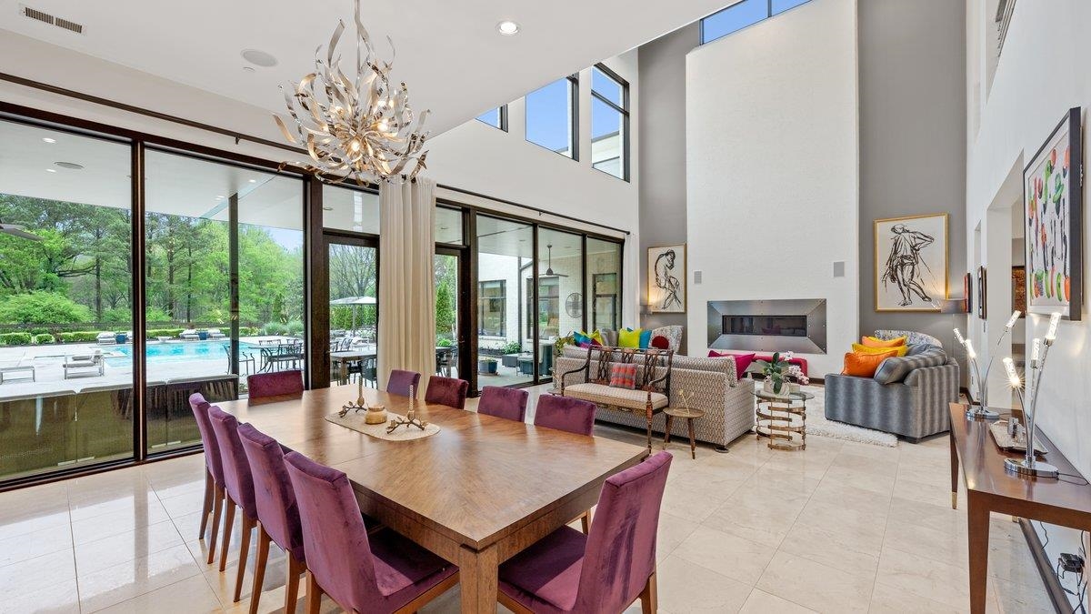 9942 Legends Drive Collierville, TN 38139 - Photo 8 of 40 a view of a dining room with furniture a chandelier and large windows