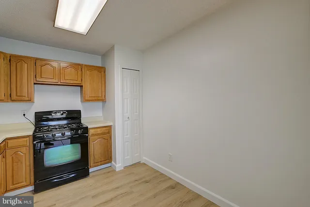 a kitchen with a stove and a microwave