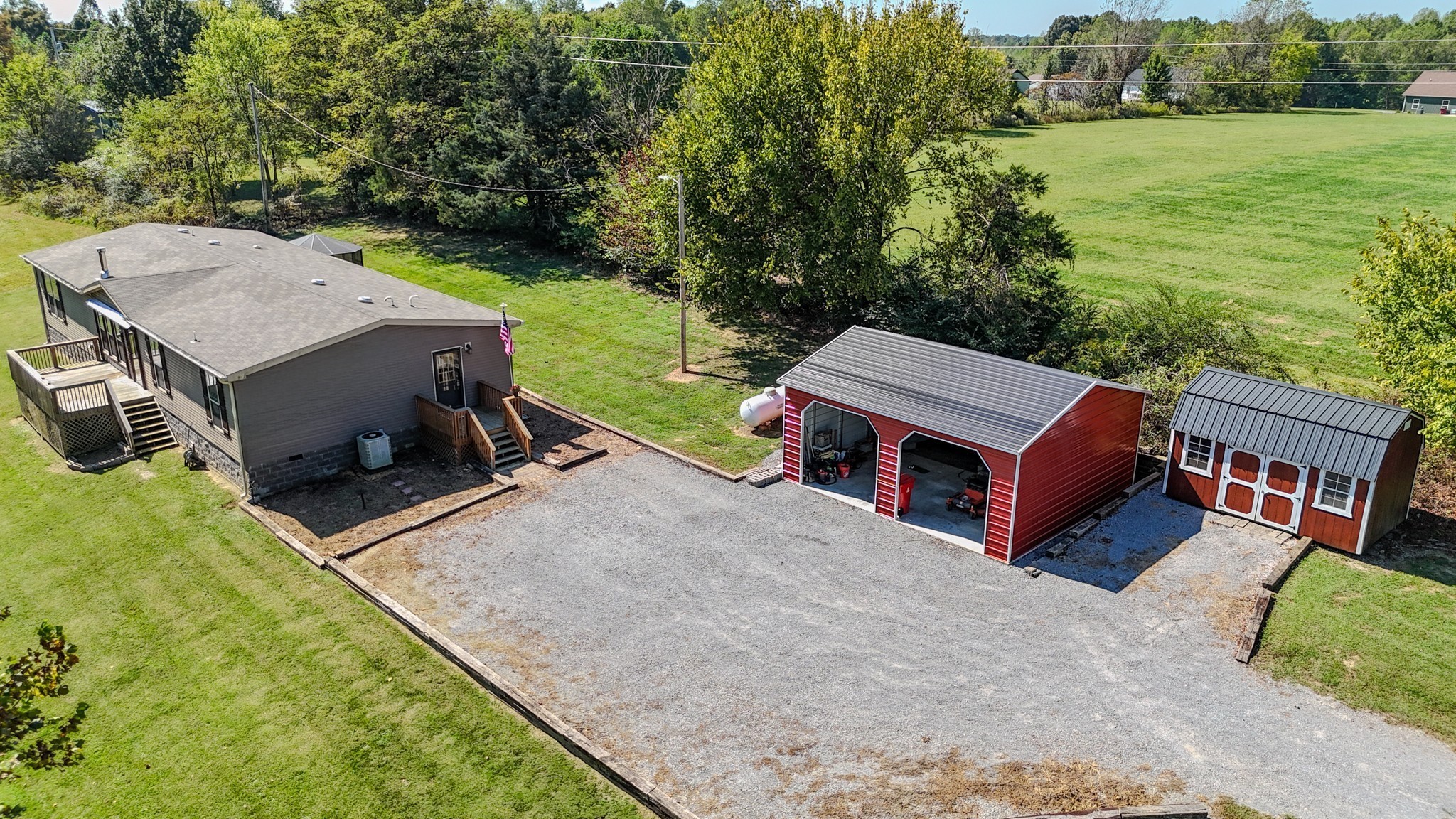 137 Hawkins Road Westmoreland, TN 37186 - Photo 3 of 71 an aerial view of a house with backyard and a garden