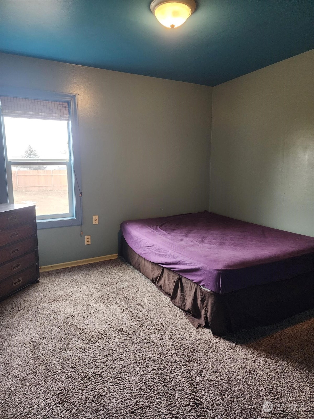 409 East Alder Avenue Ritzville, WA 99169 - Photo 14 of 20 a spacious bedroom with a bed and a window