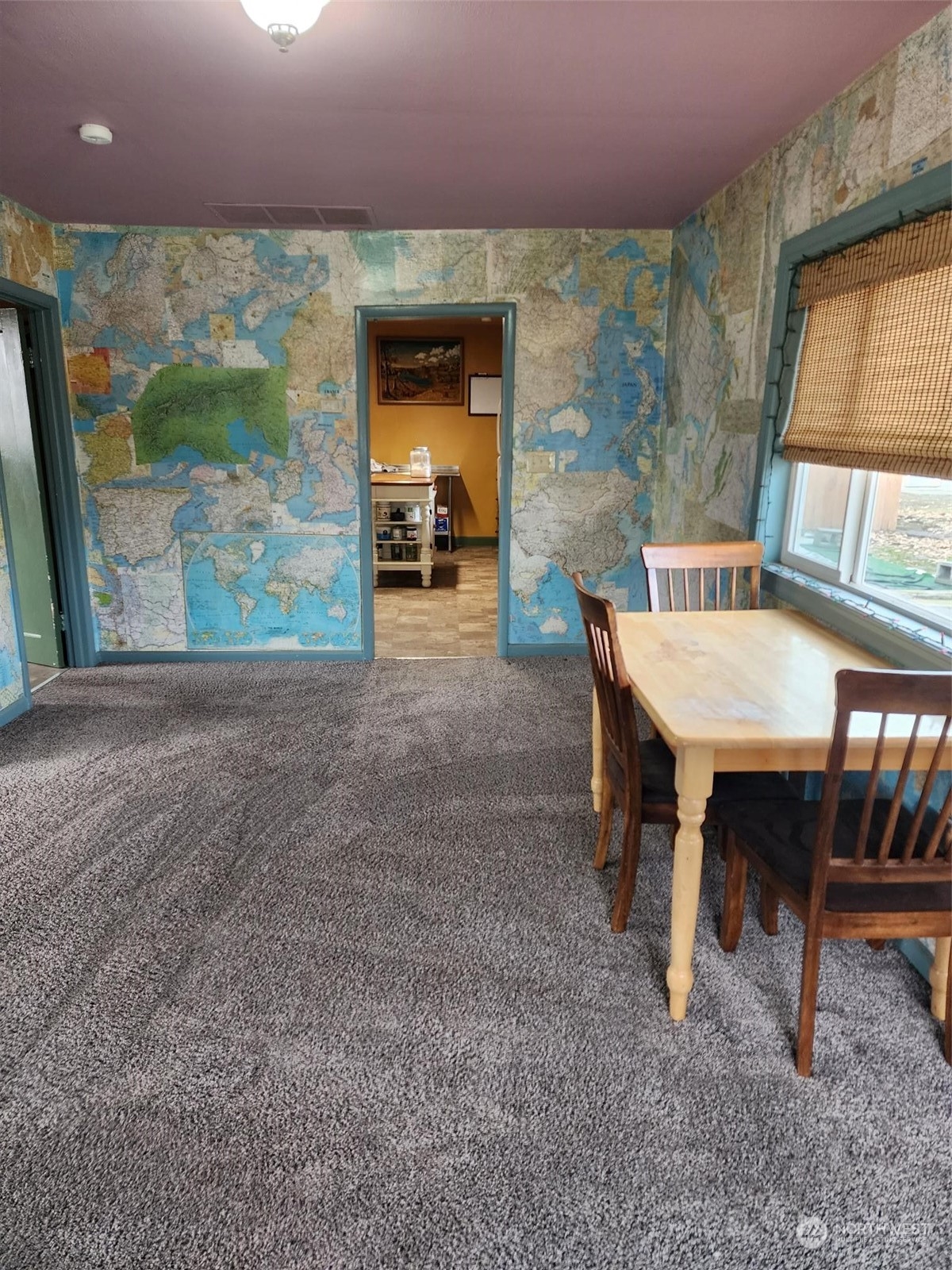 409 East Alder Avenue Ritzville, WA 99169 - Photo 7 of 20 a view of a dining room with furniture and a floor to ceiling window