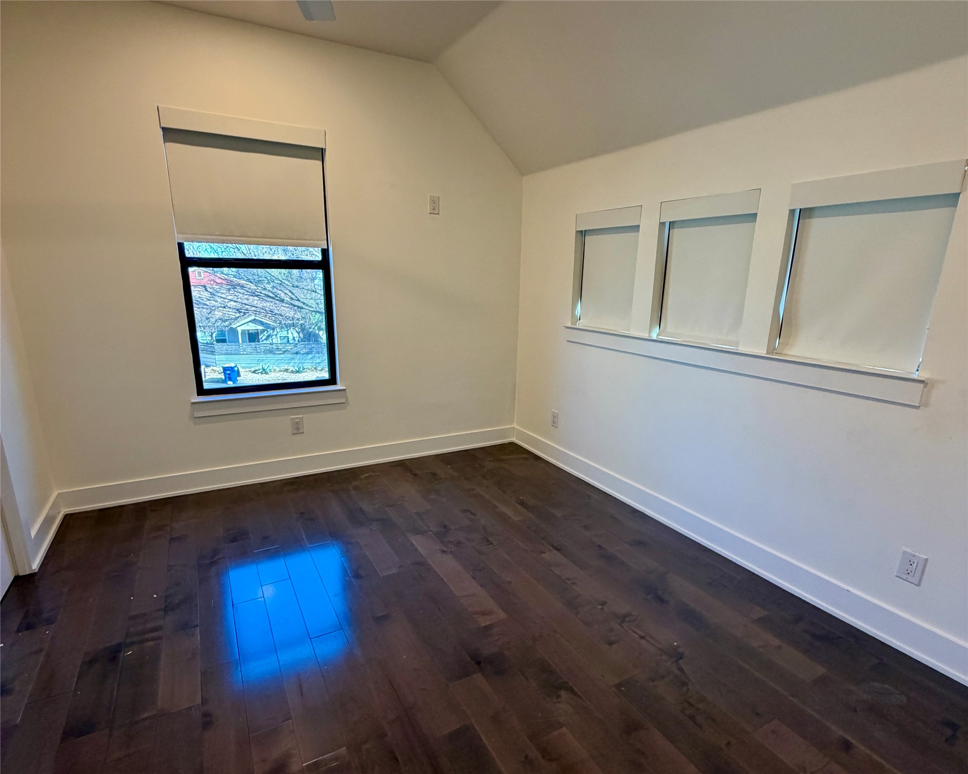 1515 Hether Street, Unit B Austin, TX 78704 - Photo 18 of 30 Rich hardwood flooring complements the crisp white walls and sun-filled windows of this adaptable space.