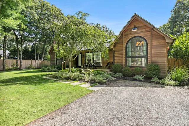 a front view of a house with garden