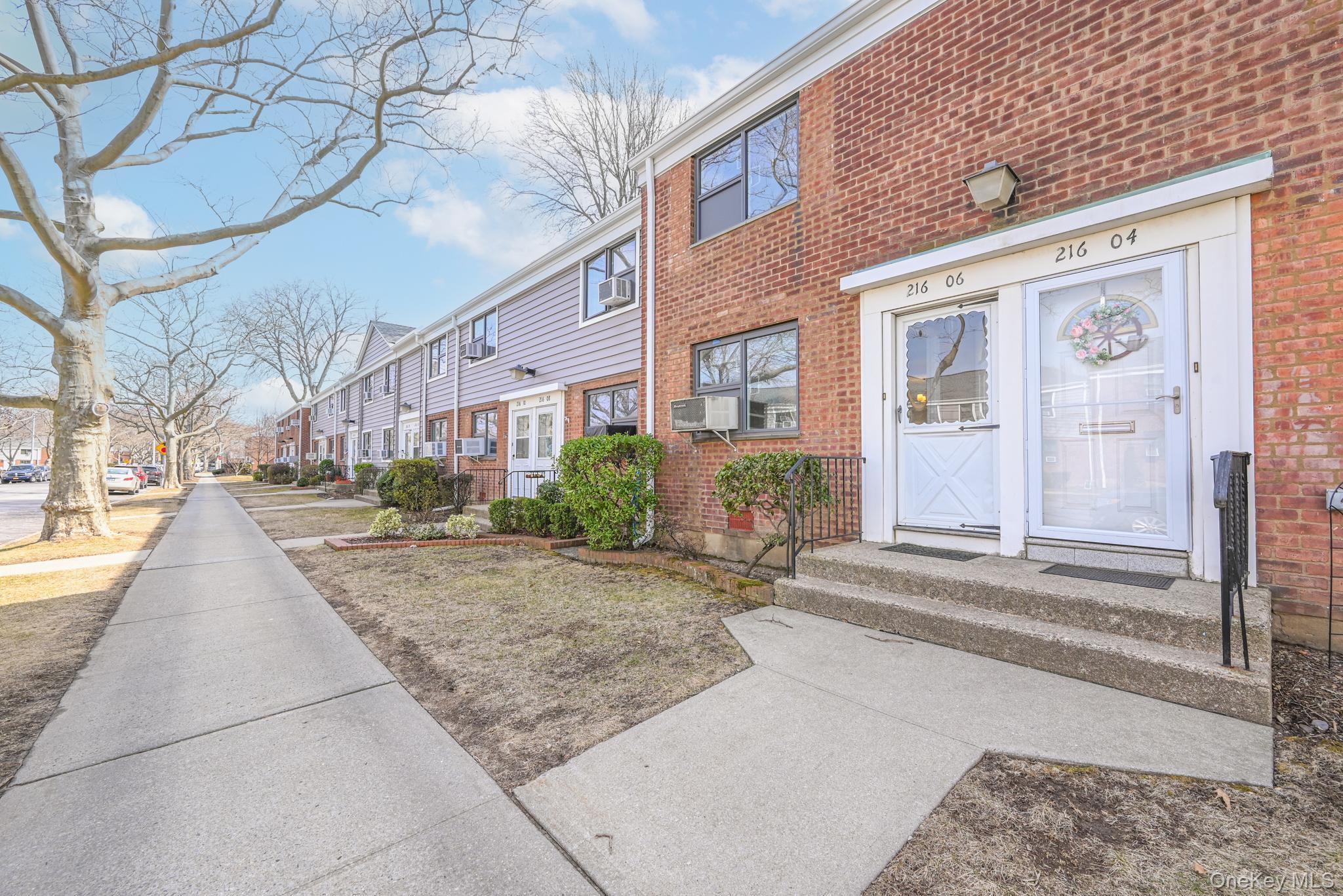 216-06 68th Avenue, Unit 2805 9 Queens, NY 11364 - Photo 11 of 14 a view of a brick building next to a road