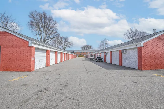 a view of a street with a big yard