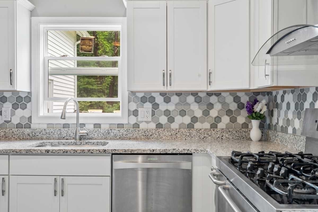 166 Packardville Road Pelham, MA 01002 - Photo 12 of 34 a kitchen with granite countertop a stove and a sink