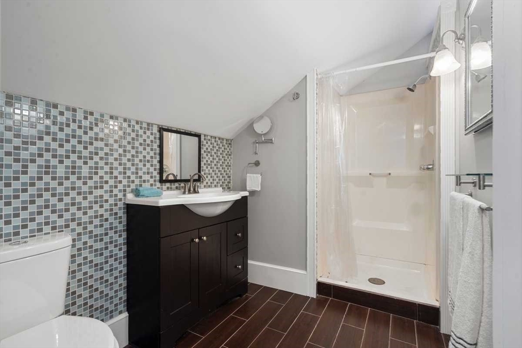 166 Packardville Road Pelham, MA 01002 - Photo 23 of 34 a bathroom with a sink a toilet a mirror and shower