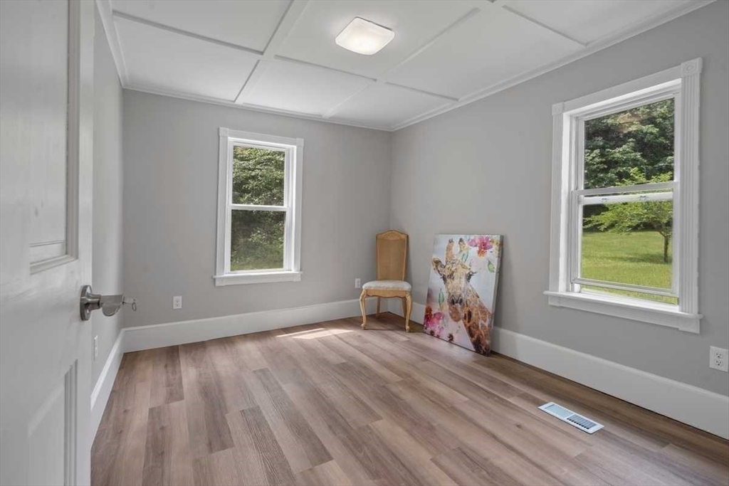 166 Packardville Road Pelham, MA 01002 - Photo 24 of 34 wooden floor in an empty room with a window