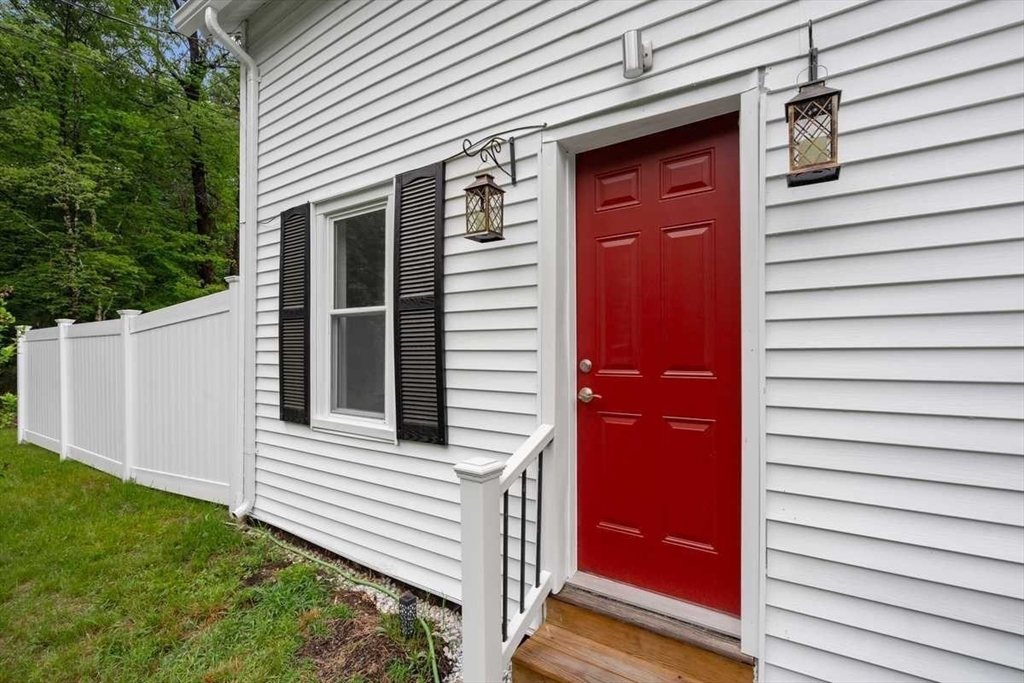 166 Packardville Road Pelham, MA 01002 - Photo 5 of 34 a view of a house with a door and a porch
