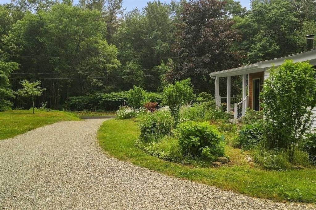 166 Packardville Road Pelham, MA 01002 - Photo 8 of 34 a view of backyard with garden