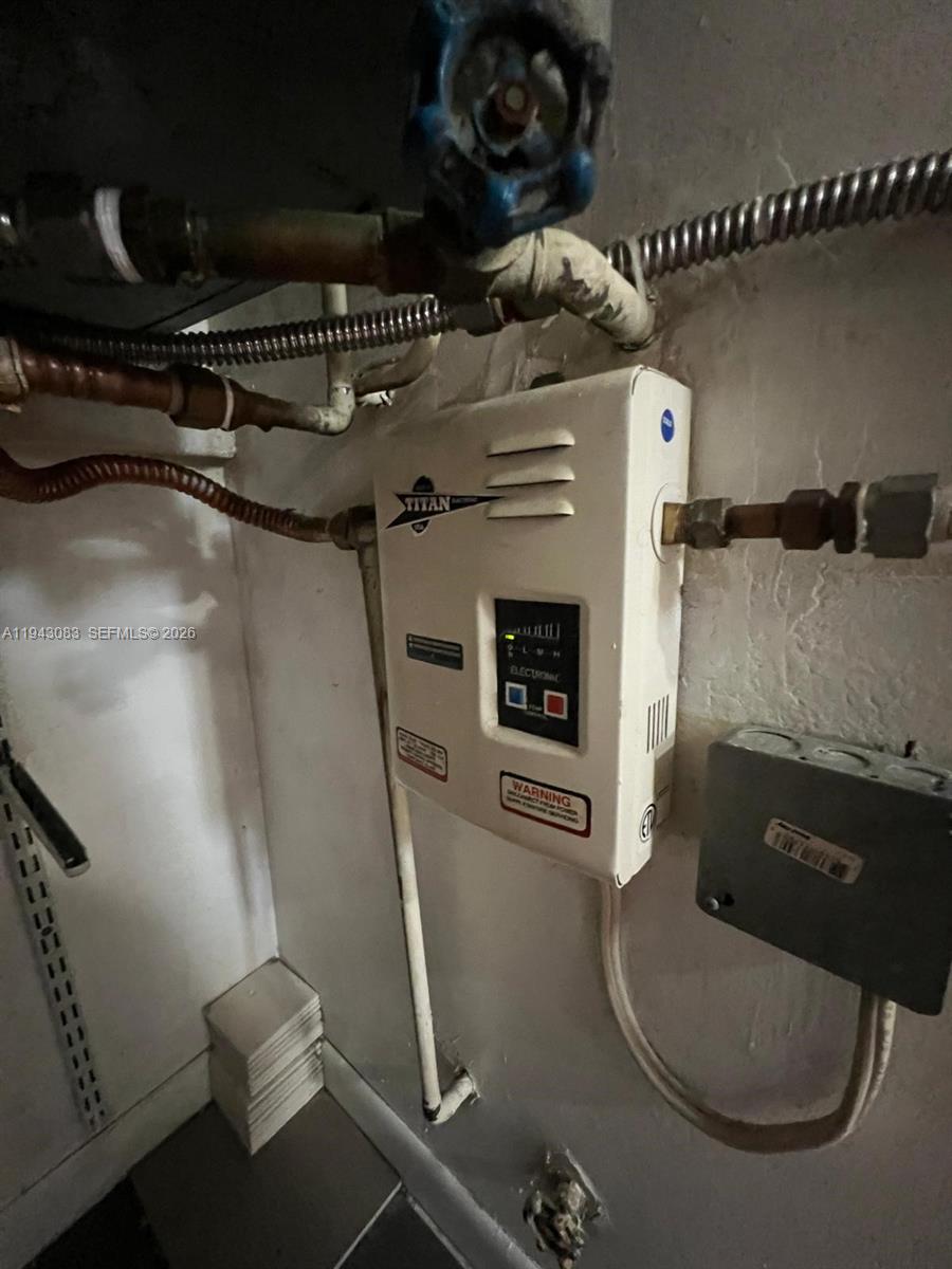 15600 Southwest 80th Street, Unit L302 Miami, FL 33193 - Photo 12 of 16 a bathroom with a toilet and a shower