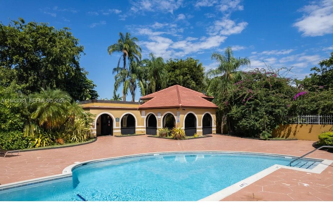 15600 Southwest 80th Street, Unit L302 Miami, FL 33193 - Photo 16 of 16 a house view with a garden space
