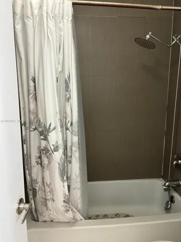 a en suite bathroom with a sink toilet and mirror