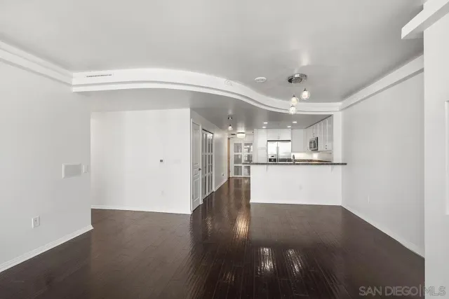a kitchen with granite countertop a stove and a sink