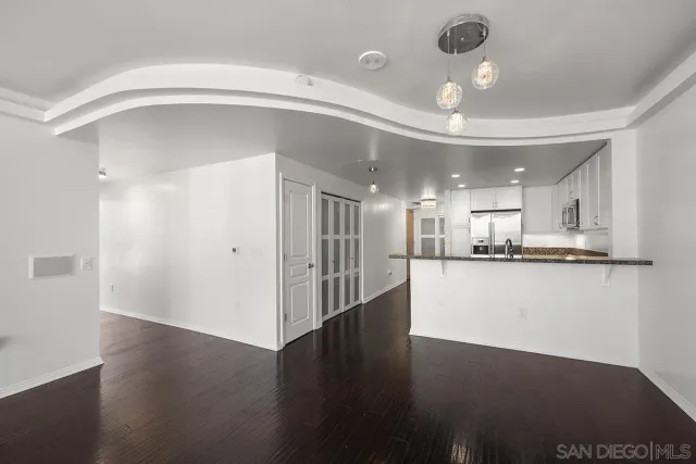 a view of an empty room with a fireplace