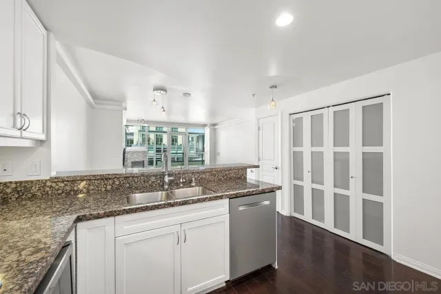a bathroom with a bathtub shower sink mirror and toilet