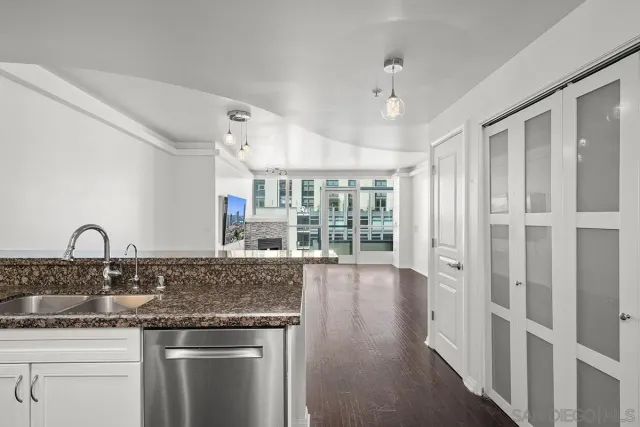 a view of a bedroom with washer and dryer