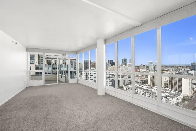 a front view of a multi story building with yard