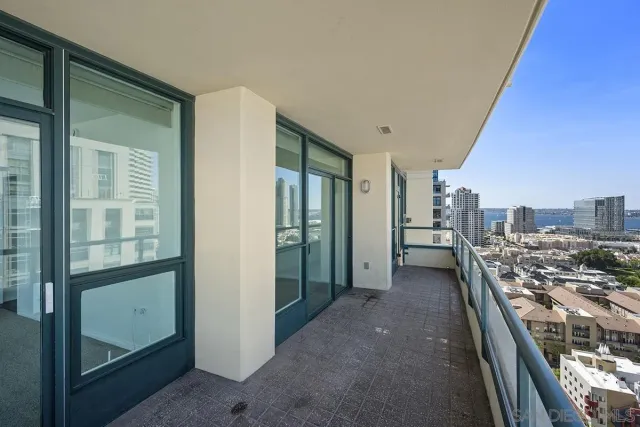 a view of kitchen and hall with wooden floor