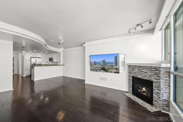 a kitchen with granite countertop white cabinets and stainless steel appliances