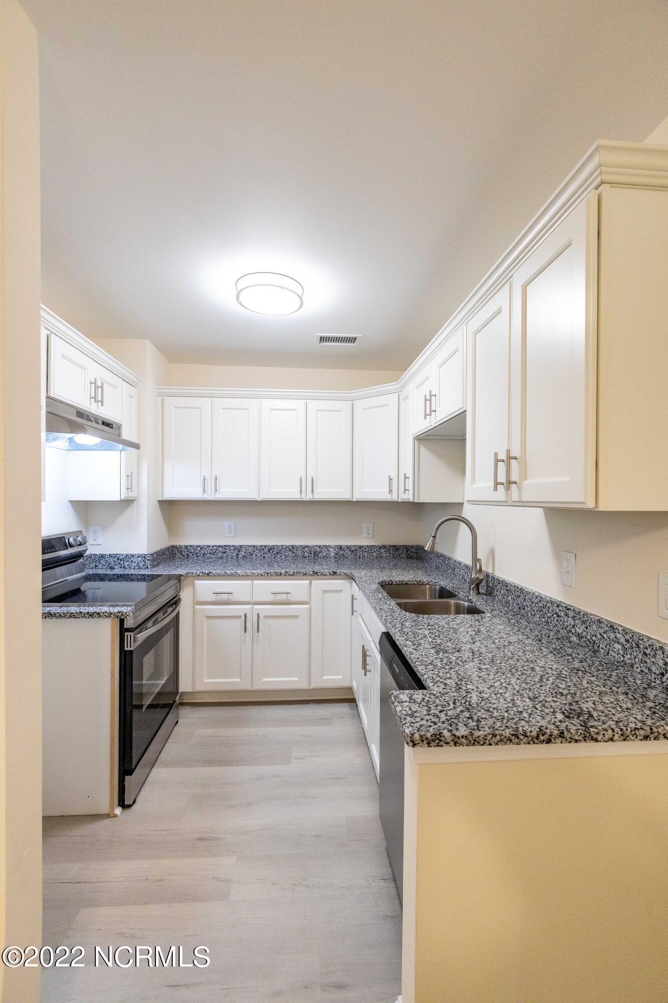 2036 Sloop Point Loop Road, Unit A8 Hampstead, NC 28443 - Photo 8 of 17 Kitchen