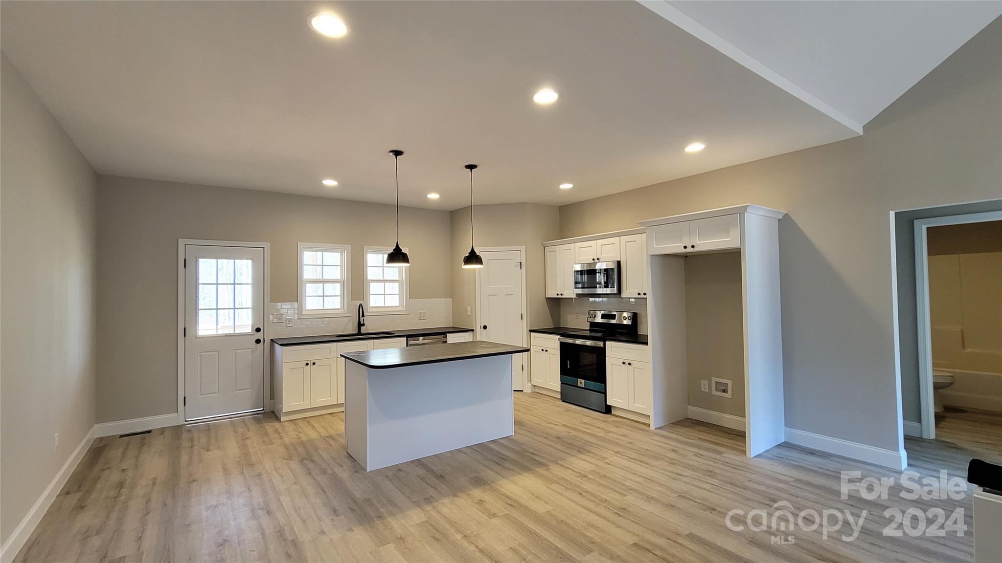 308 Pamela Road, Unit 5 York, SC 29745 - Photo 5 of 20 a kitchen with stainless steel appliances granite countertop a stove and a refrigerator