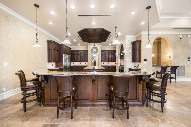 a stove top oven sitting inside of a kitchen