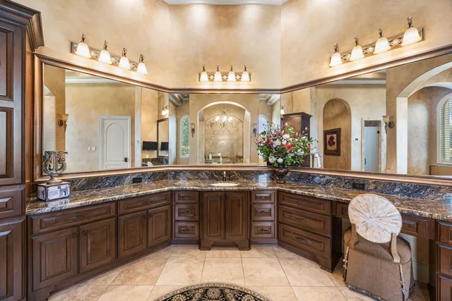 a bathroom with a shower and a sink