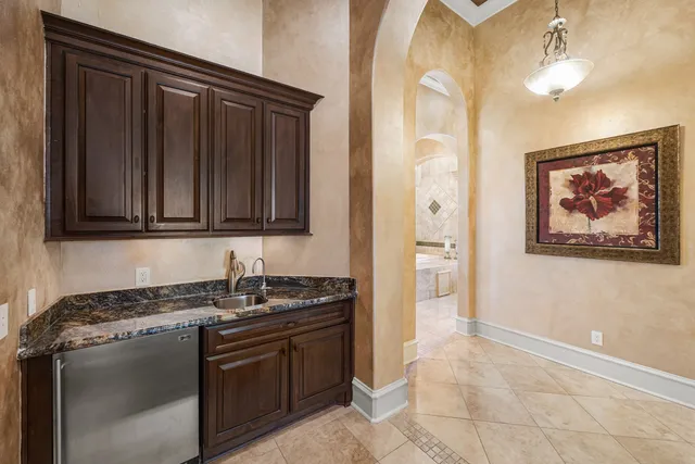 a view of walk in closet with clothes