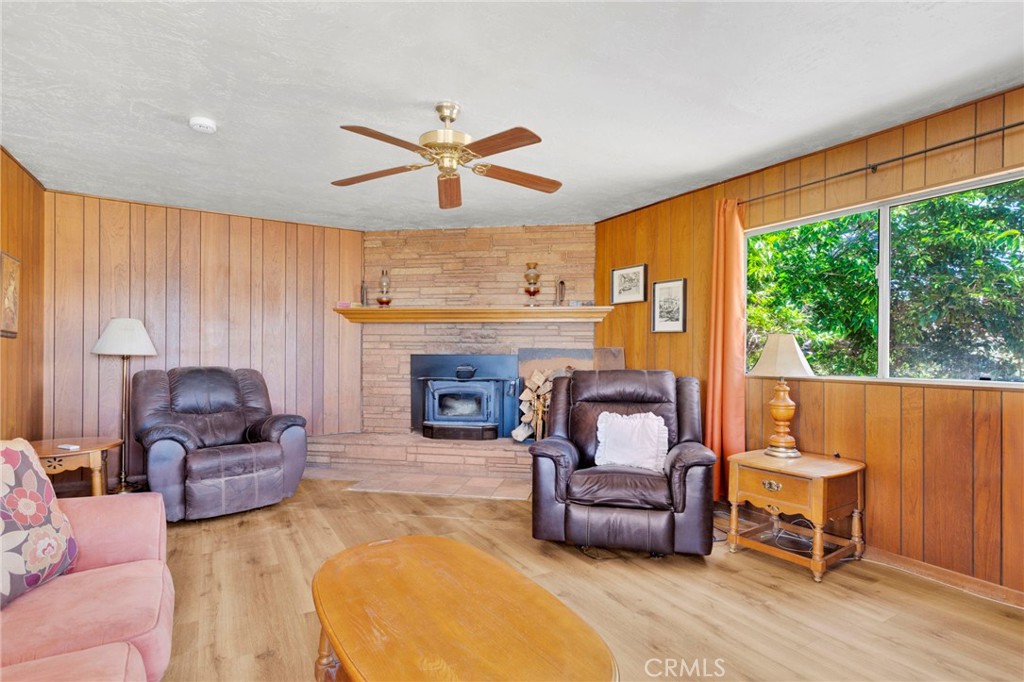 5500 Oil Well Road Phelan, CA 92371 - Photo 16 of 65 a living room with furniture and a fireplace