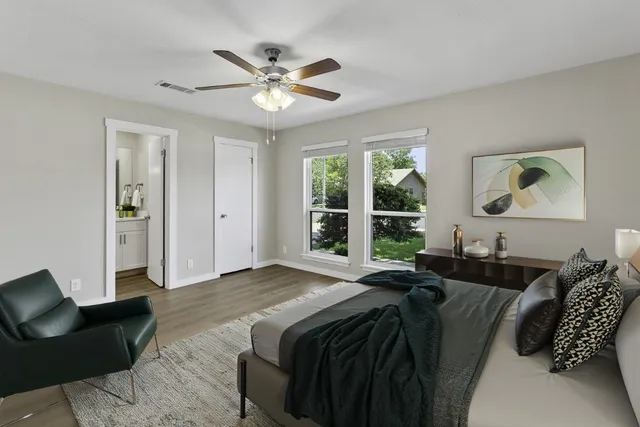 a bed room with a bed window and couch