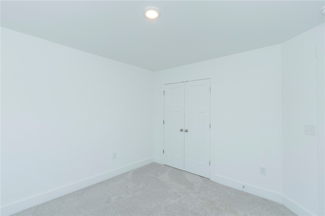 607 WH Kay Lane Anderson, SC 29621 - Photo 30 of 48 A well-lit, quiet bedroom with plush carpeting and ample storage options.