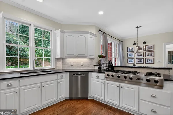 a room with lots of books and a baby crib