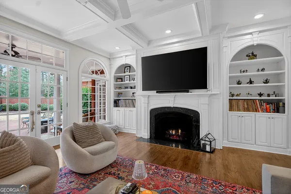 a living room with a large window and a table